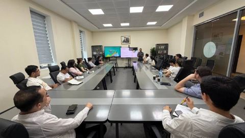 Participants at a seminar in a conference room