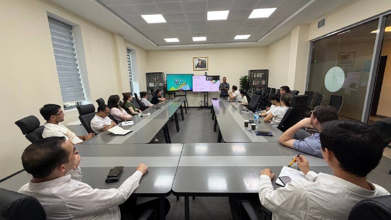 Participants at a seminar in a conference room