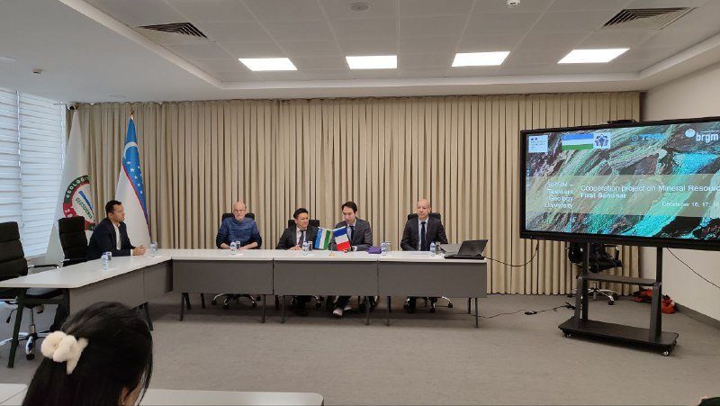 Delegates at a meeting in a conference hall