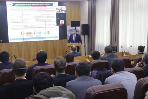 Participants seated in a forum hall