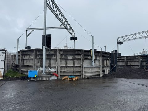 Large circular fish tanks at an outdoor fish farm
